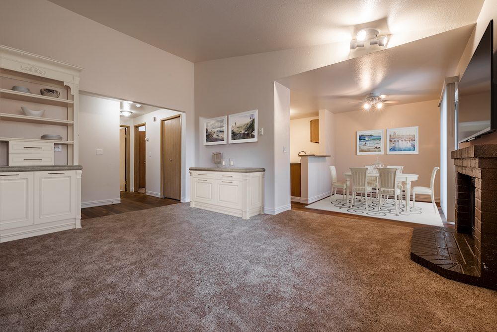 Living and dining room with a wood burning fireplace